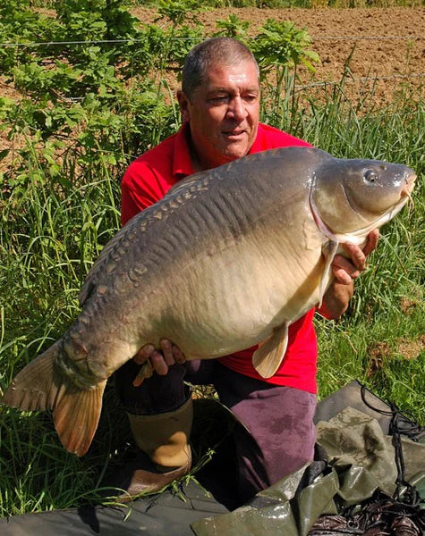 Ken Townley holding a carp