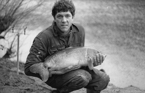 Fisherman Ken Townley holding carp 